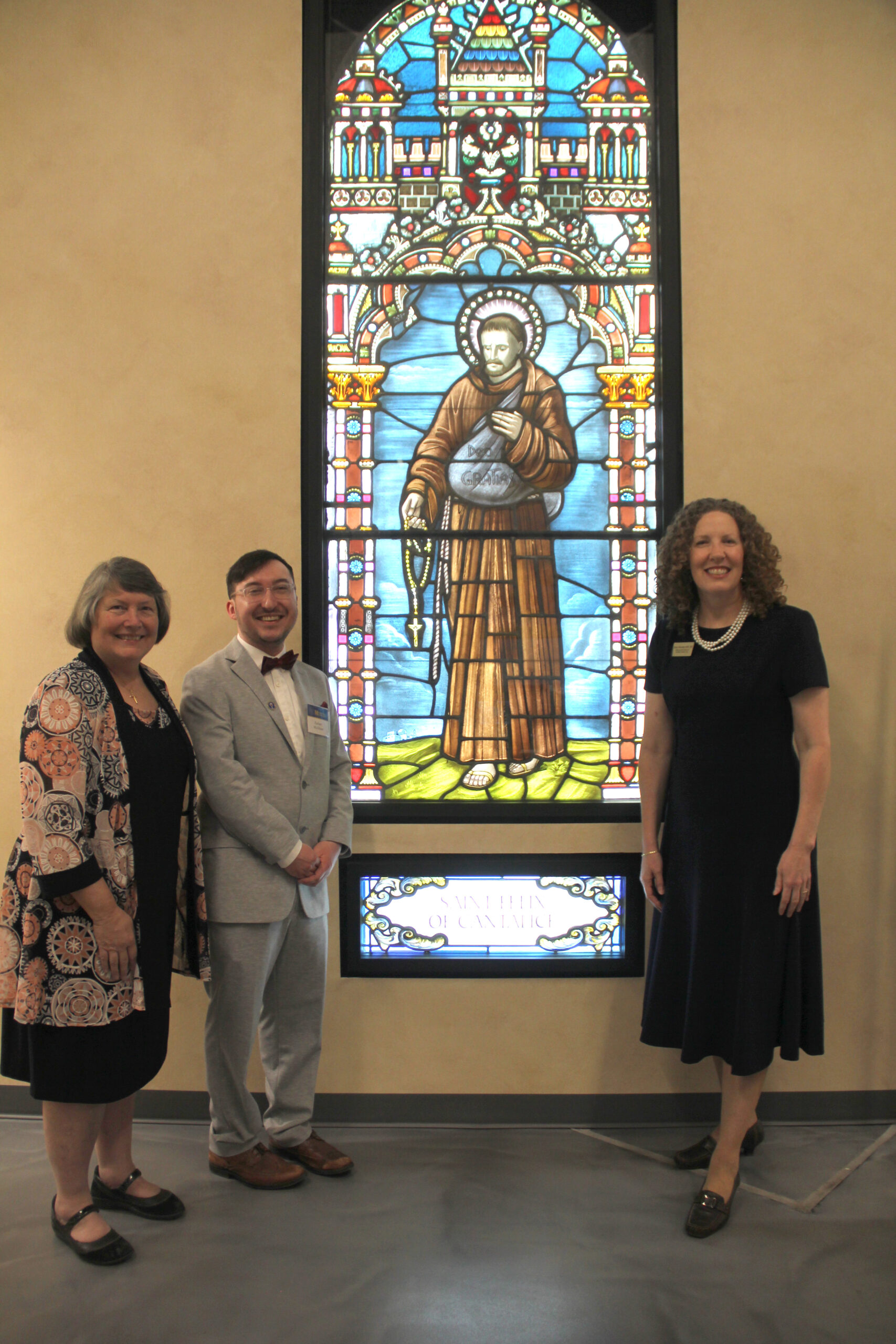 Diana Ruzicka, Zachary McAllister and Janet Munday with Saint Felix of Cantalice